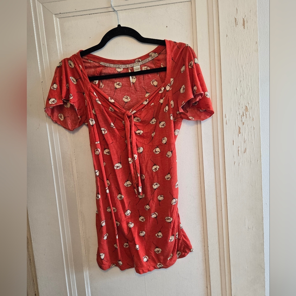 Red-orange floral top